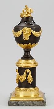 A Louis XVI table urn.