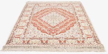 A semi-antique silk Hereke rug, West Anatolia, c. 180 x 121 cm.