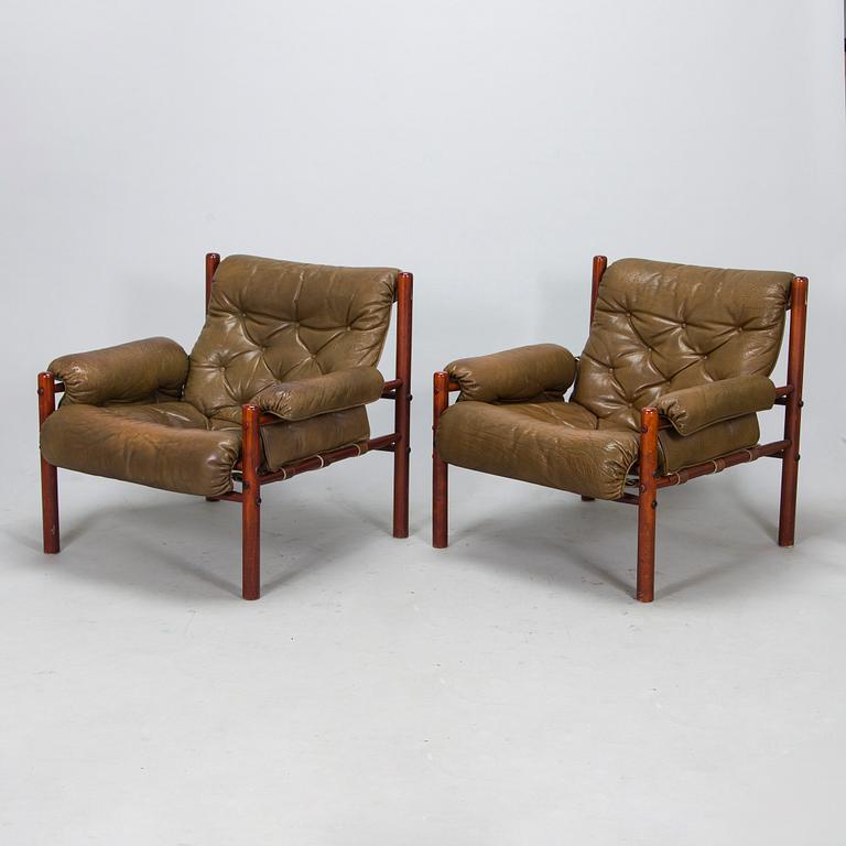 A pair of leather armchairs, 1970s.