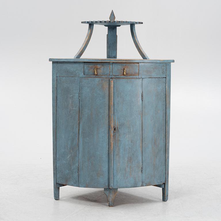 A painted corner cabinet, late 19th century.