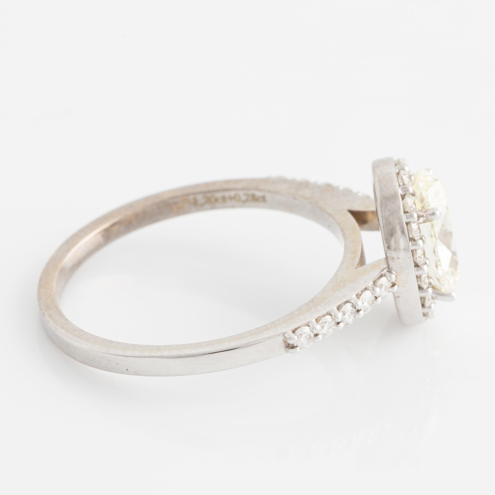 Ring with oval diamond, accompanied by GIA report.
