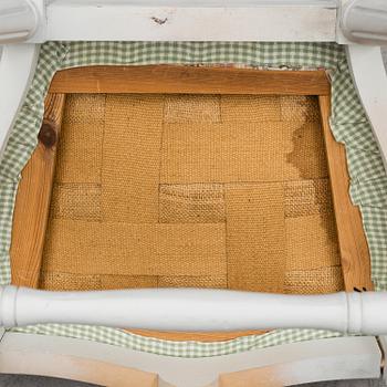A Gustavian style dining table and ten chairs, 20th century.