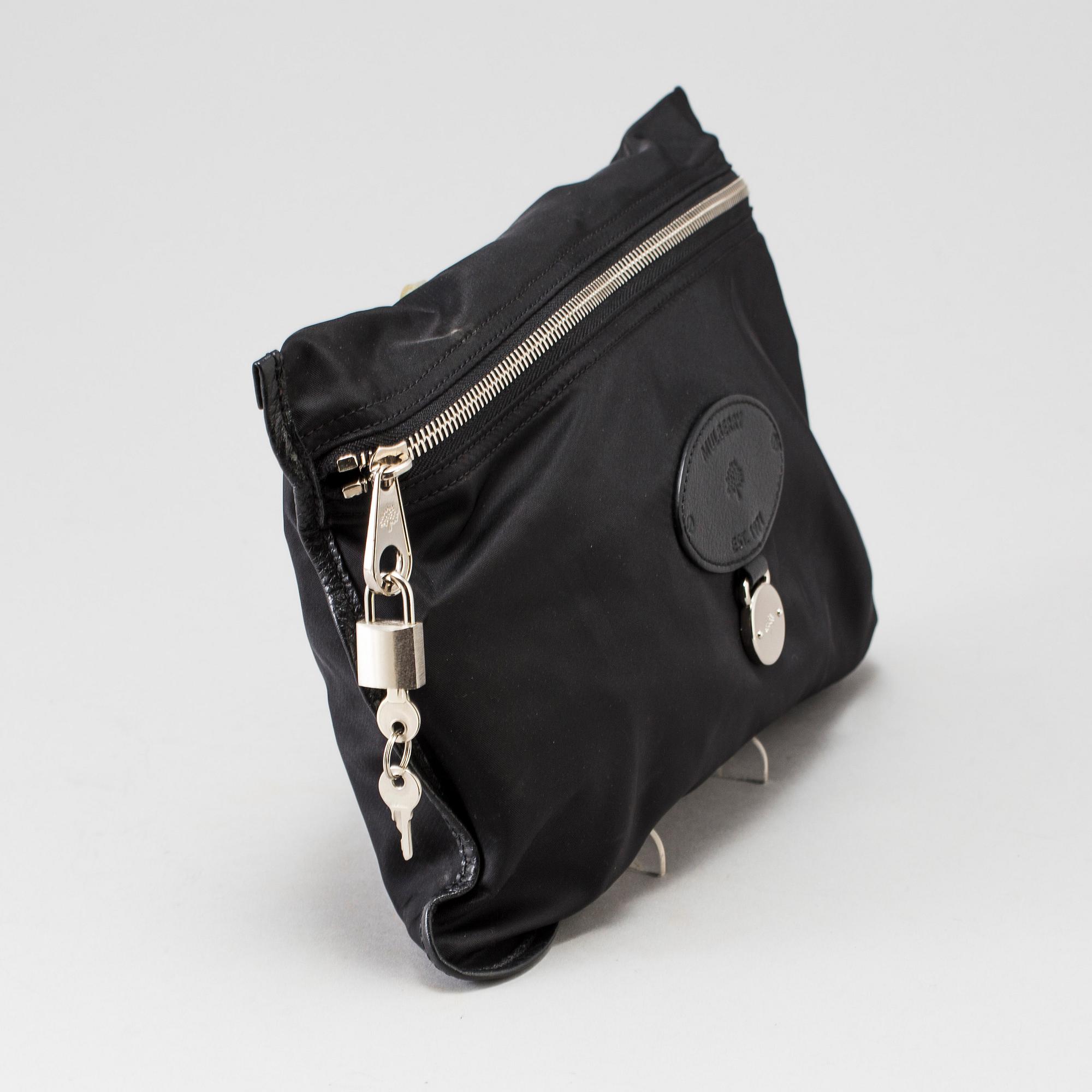 A foldable Mulberry weekend bag.