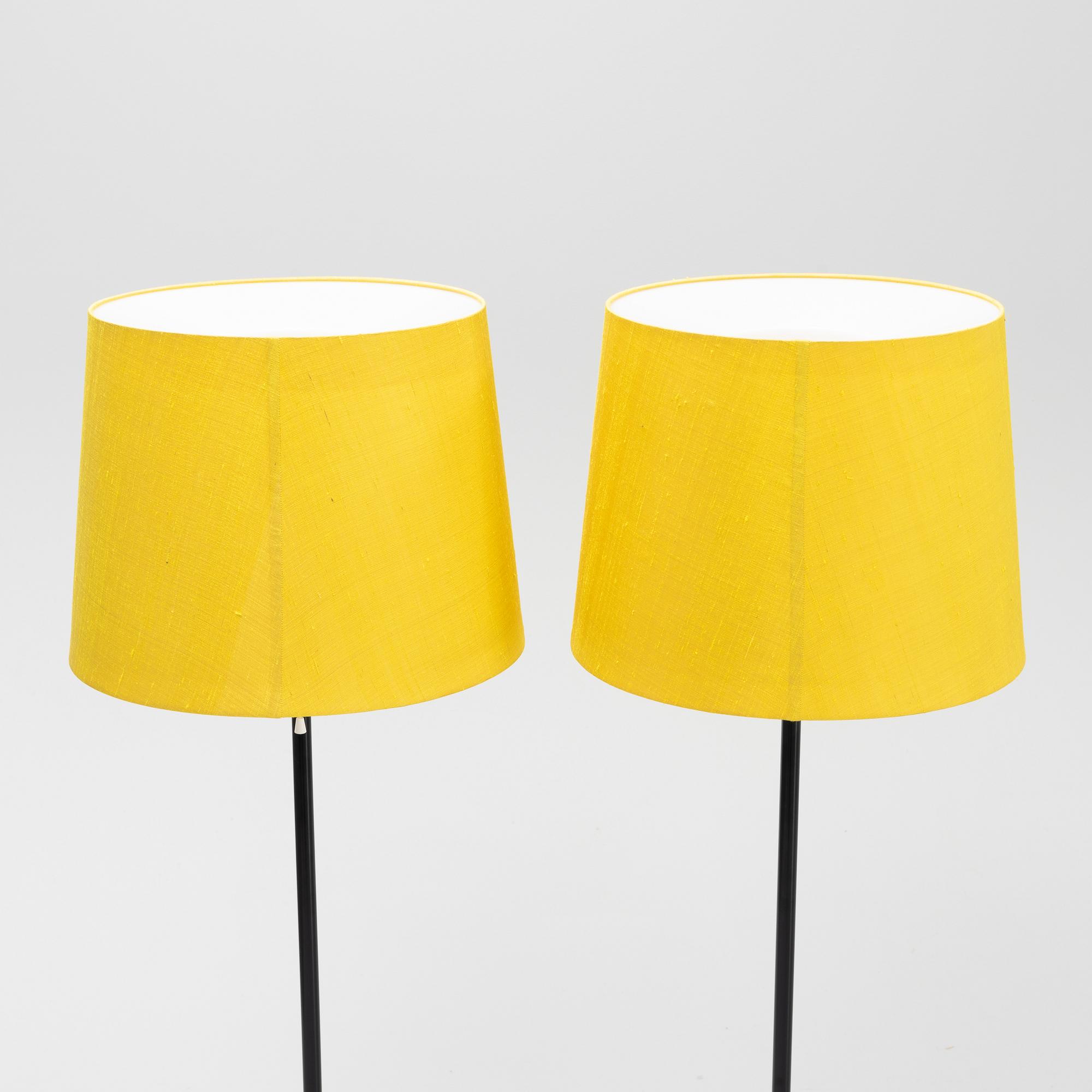 A pair of black metal floorlights, Luxus, Vittsjö.