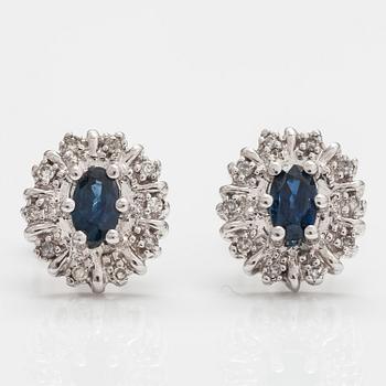 A pair of 14K white gold earrings with sapphires and diamonds ca 0.05 ct in total.