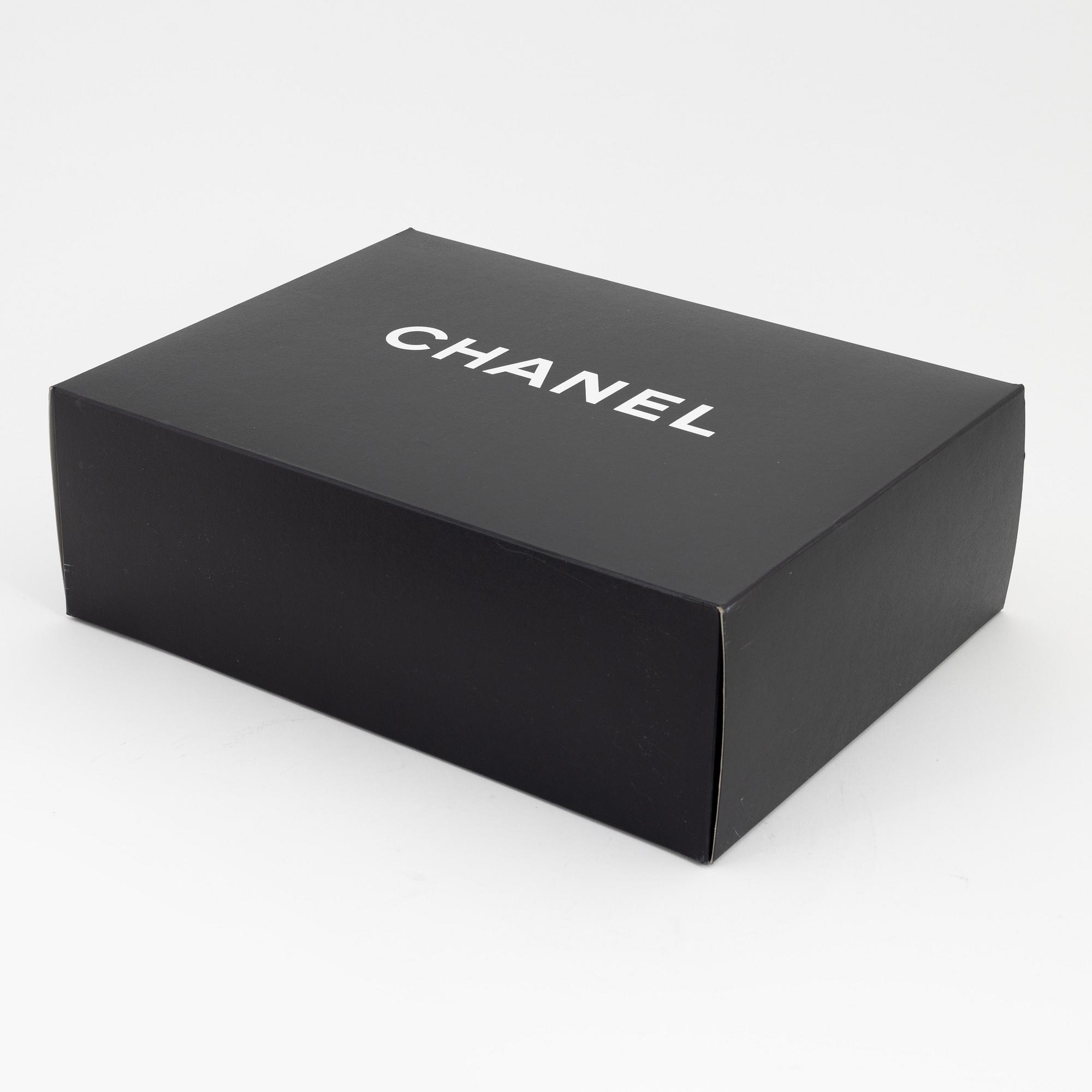 Chanel, a black caviar leather briefcase.