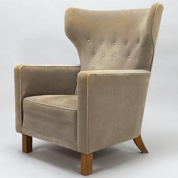 A 1940s stuffover armchair, 'Mexico', manufacturer oy Paul Boman ab, Finland.