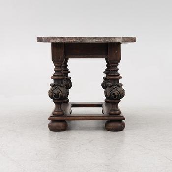 A 19th century Baroque style stone-top table.