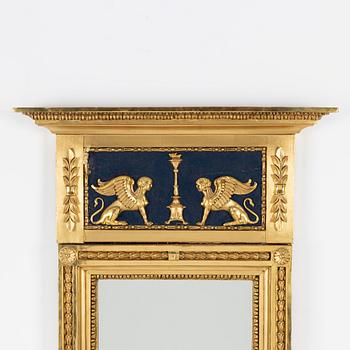 An Empire mirror, first half of the 19th Century.