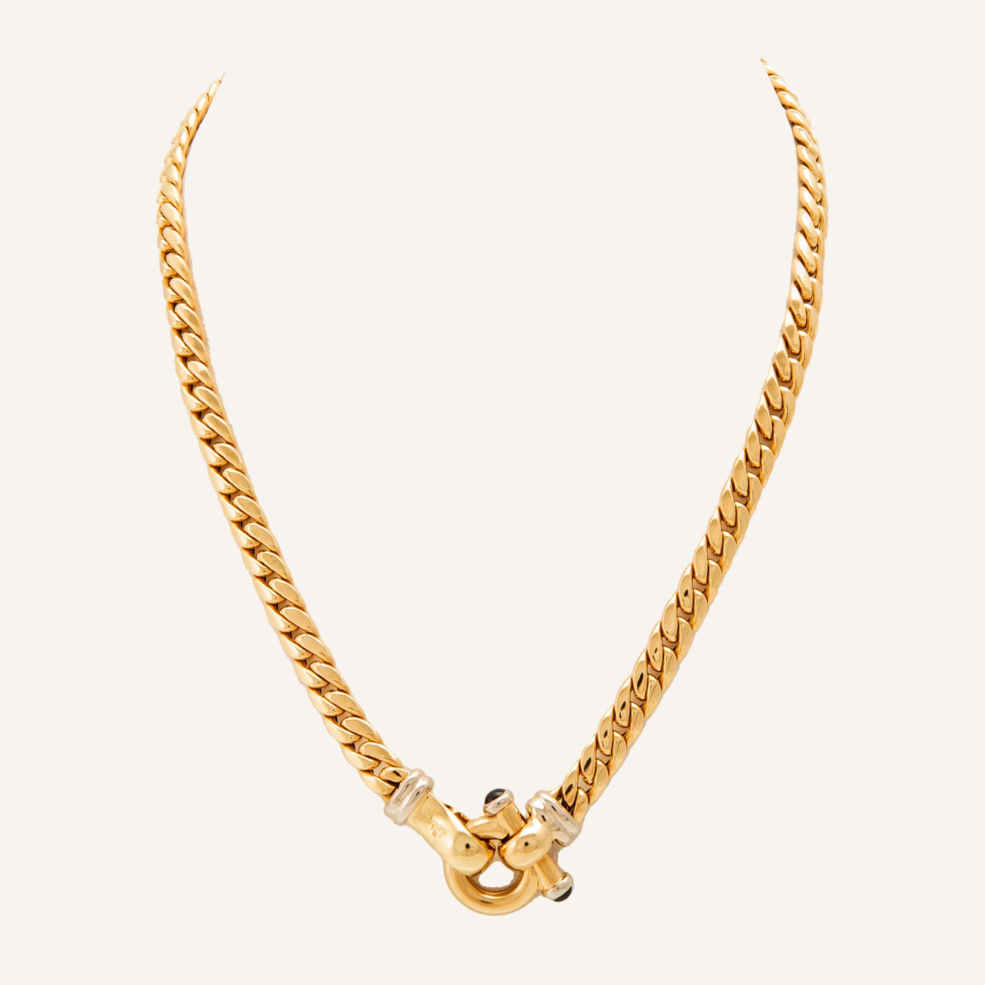 An 18K white and yellow gold necklace set with two cabochon-cut sapphires Italy 1980s.