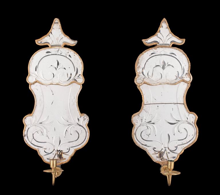 A pair of Swedish Rococo 18th century one-light girandole mirrors.