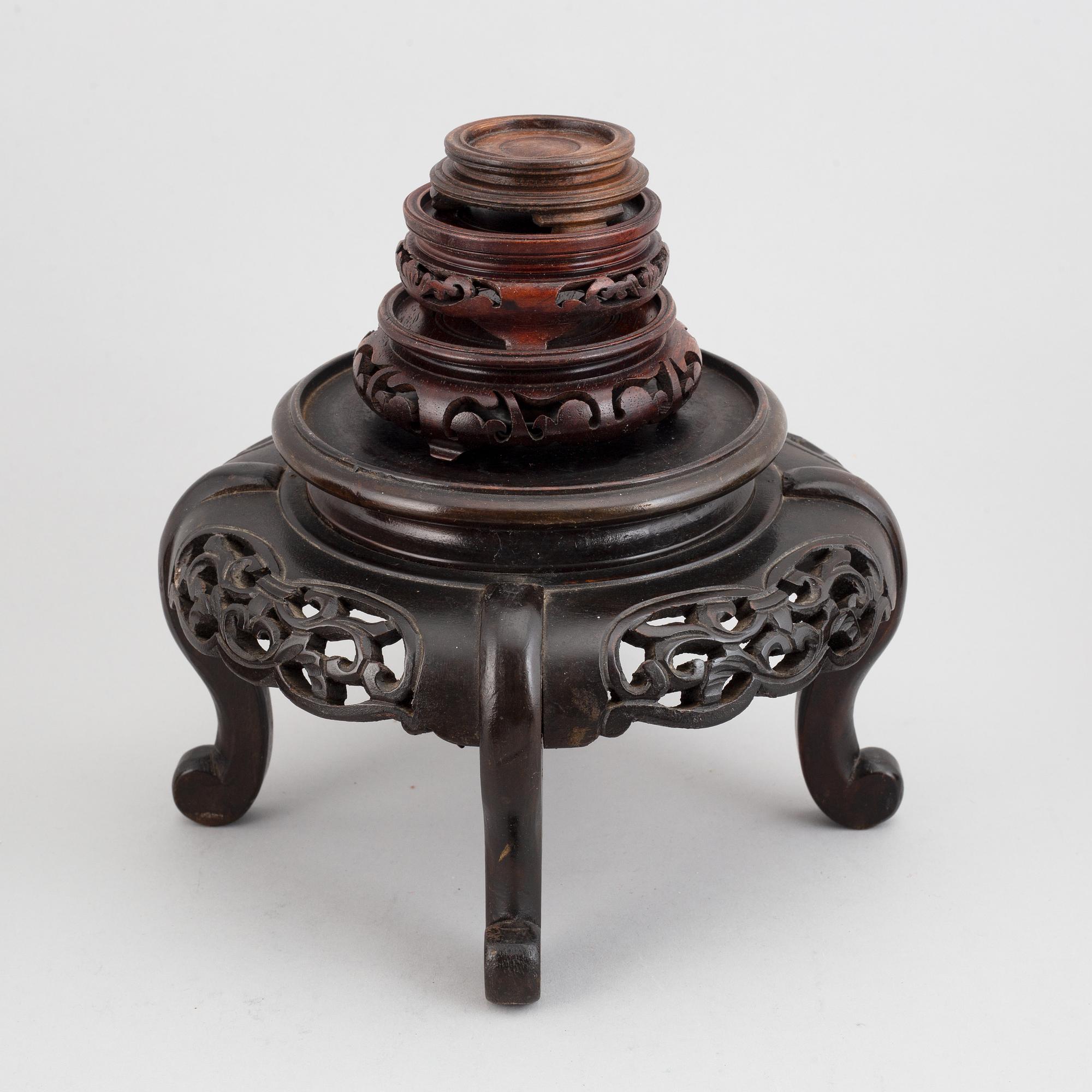 A group of 22 Chinese wooden stands, 20th century.