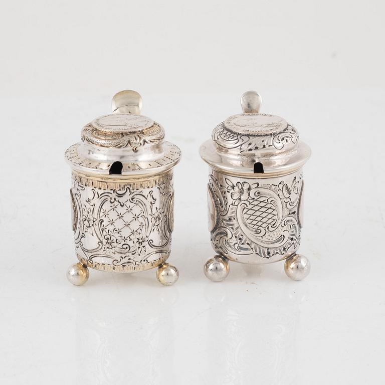 Candlesticks, a pair, Gustaf Möllenborg, Stockholm 1844, and two salt cellars including CG Hallberg, Stockholm 1897.