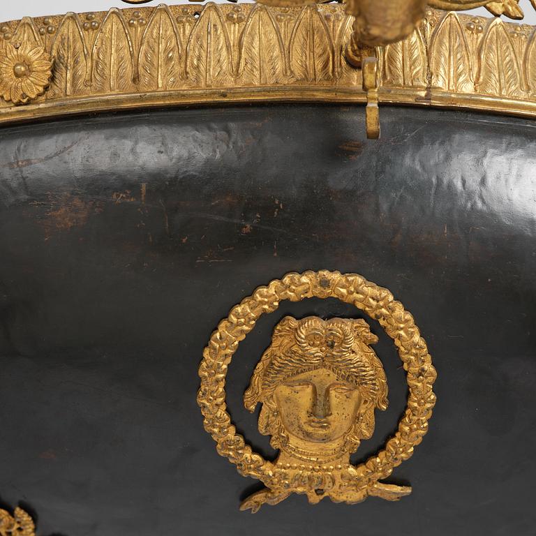 A presumably Russian Empire gilt and patinated bronze nine-branch chandelier, 19th century.