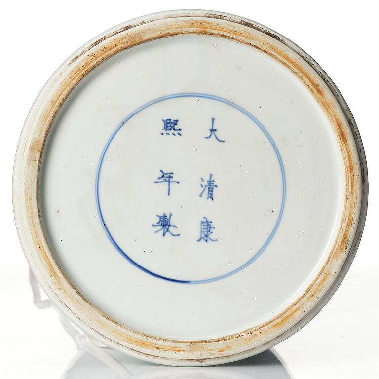 A celadon, copper-red and underglaze blue carved beaker vase, Qing dynasty, Kangxi mark and of the period (1662-1722).