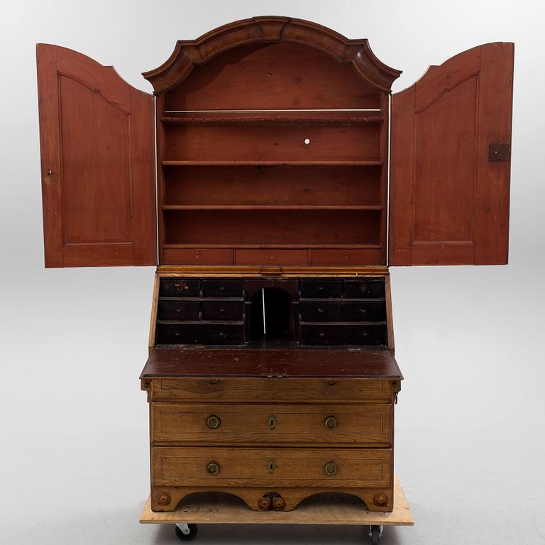 A first half of the 18th century oak writing cabinet.