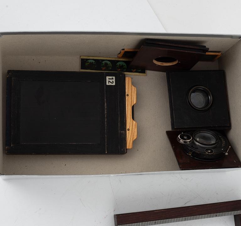 Two box cameras with accessories and a handheld stereo viewer.