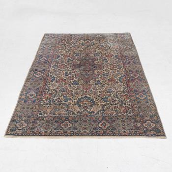 A semi-antique Kerman carpet, c. 273 x 172 cm.