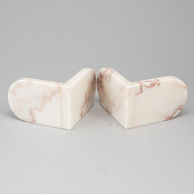 A pair of marble book ends, 20th century.