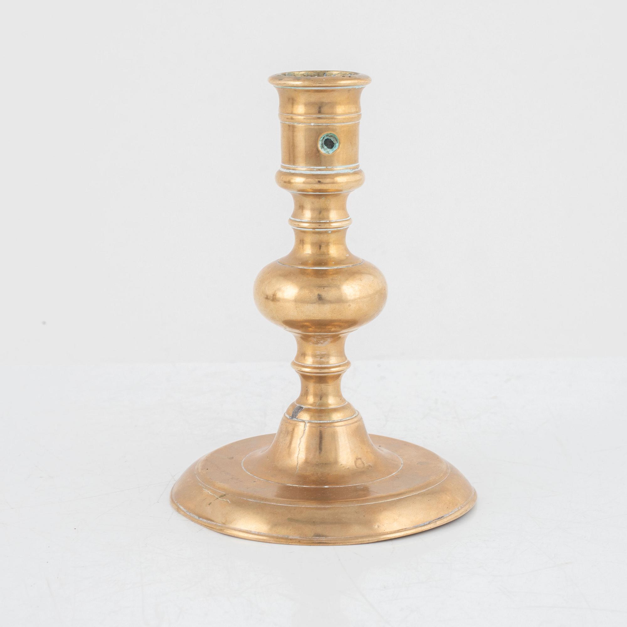 A Baroque brass candlestick, 17th century.