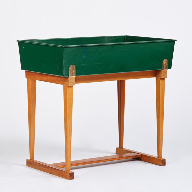 Josef Frank, a rare flower table with green lacquered box model B 2084, Firma Svenskt Tenn, 1950-60s.
