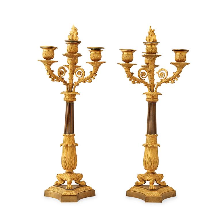 A pair of French Empire early 19th century four-light candelabra.