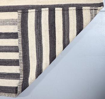 A FLATWEAVE RUG, 292 x 246 cm.