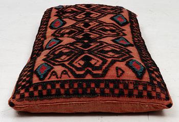 A carriage cushion, knotted pile in relief, ca 106 x 47, southwest of Scania, Sweden, circa 1800.