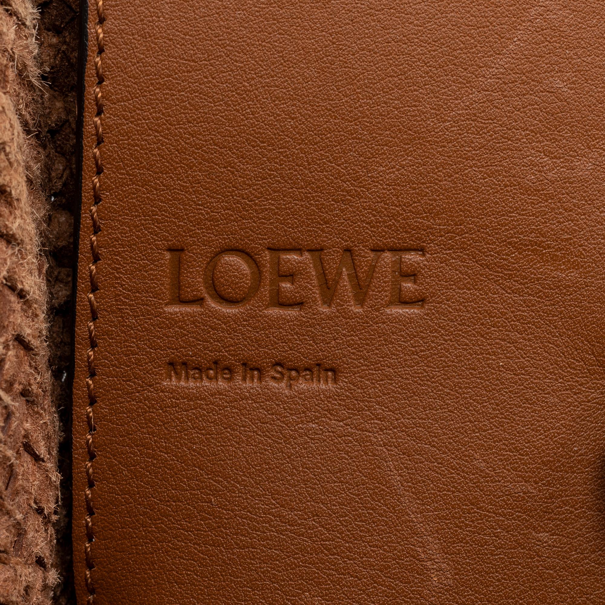 Loewe, a brown woven leather handbag.