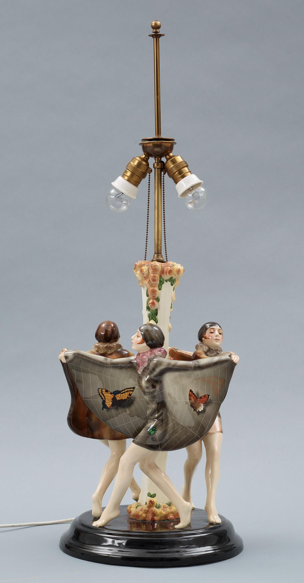 A Josef Lorenzl "The captured bird" triple figural lamp, Goldscheider, Wien circa 1925.