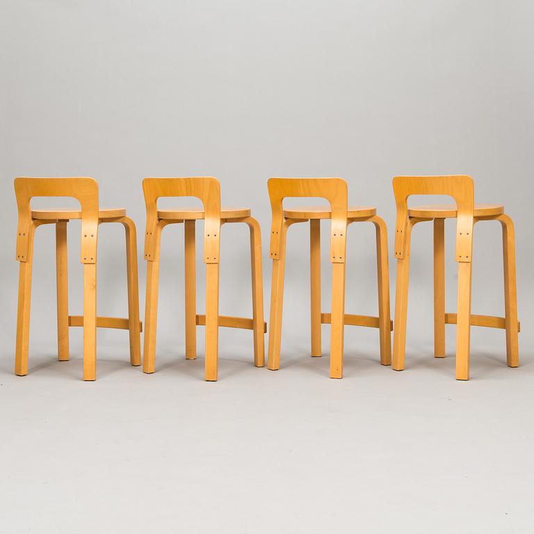 Alvar Aalto, A set of four K65 bar stools, Artek, Finland, late 20th century.