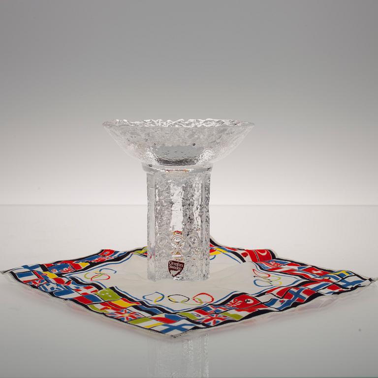 LJUSSTAKE, glas, "Olympiska elden" Orrefors, och DUK, OS-motiv, Helsingfors.