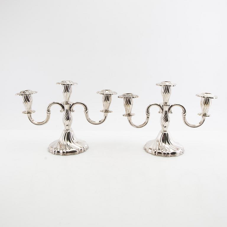 Candelabras a pair and candlesticks a pair Rococo style silver plate 20th century.