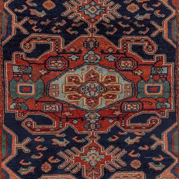 A Heriz rug, c. 192 x 133-139 cm.