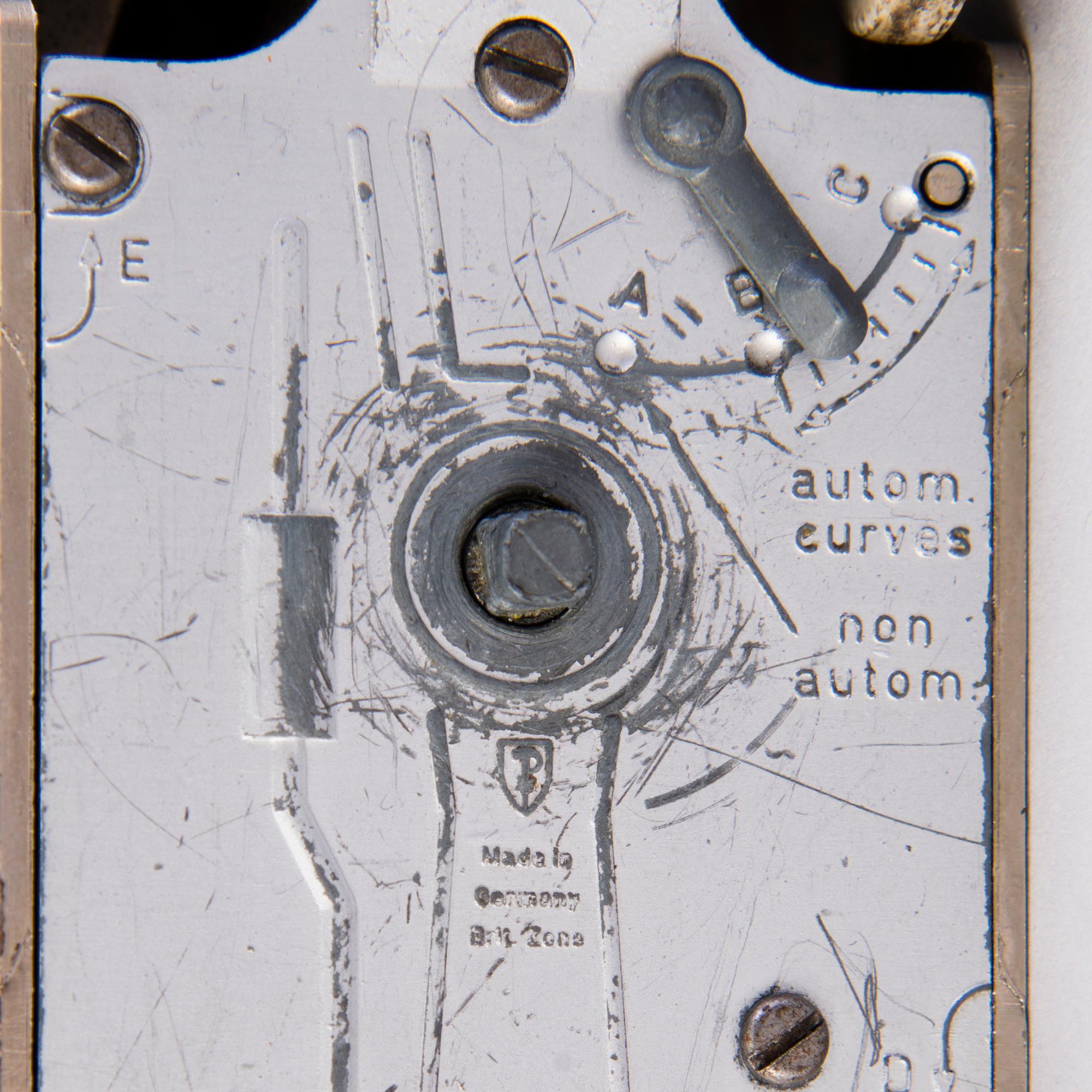 Two mid-20th century toy cars, chromed metal and wood.