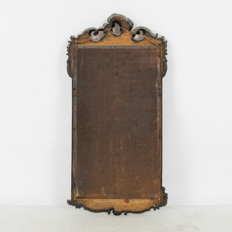 A Rococo revival mirror and a console table, second half of the 20th Century.
