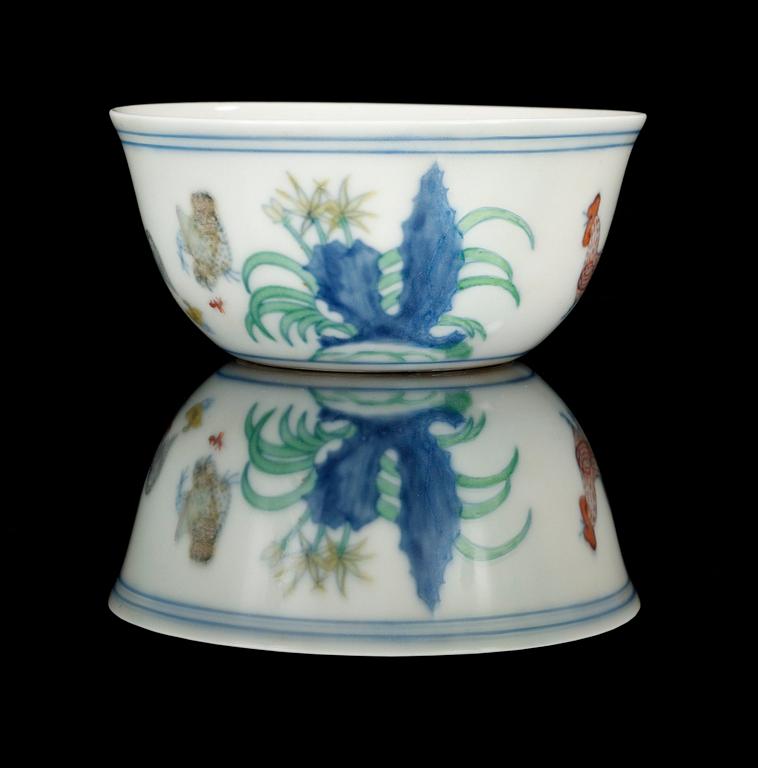 A rare doucai 'Chicken' cup, Ming dynasty, six character mark and period of Chenghua (1465-87).