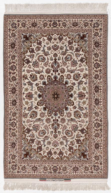 A semi-antique Isfahan rug, central Persia, signed Ghaffarian, c. 180 x 112 cm.