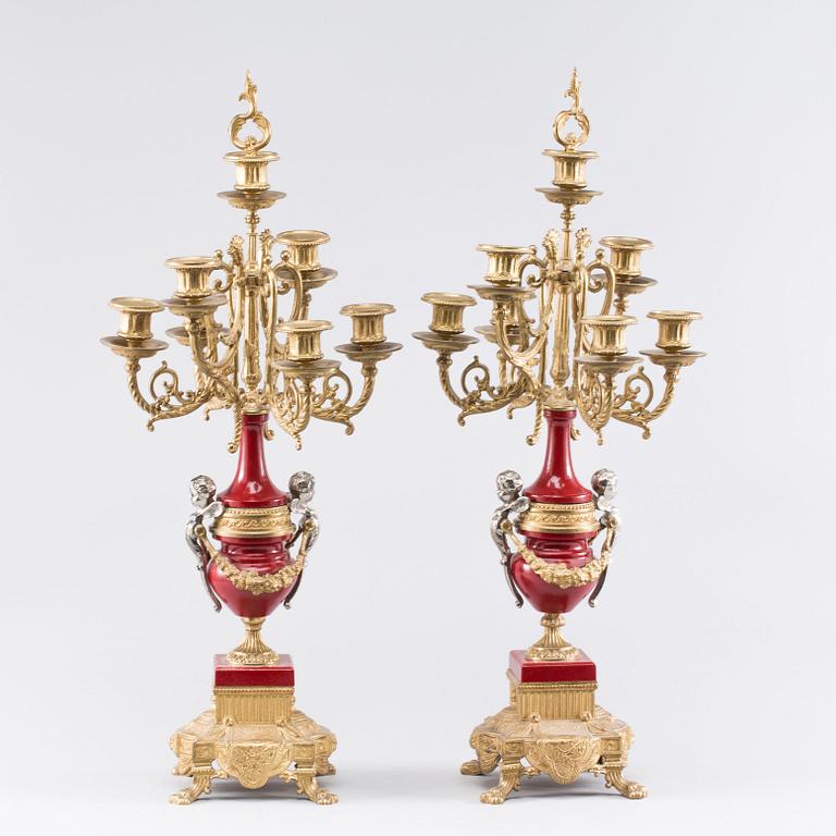 A Franz Hermle mantel clock and a pair of chandelabras. mid/2:nd half of the 20th century.