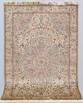 An Oriental silk rug, approx. 153 x 95 cm.