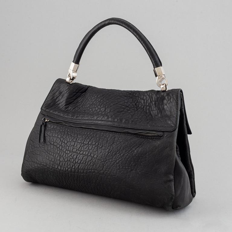 Yves Saint Laurent, a black leather bag.