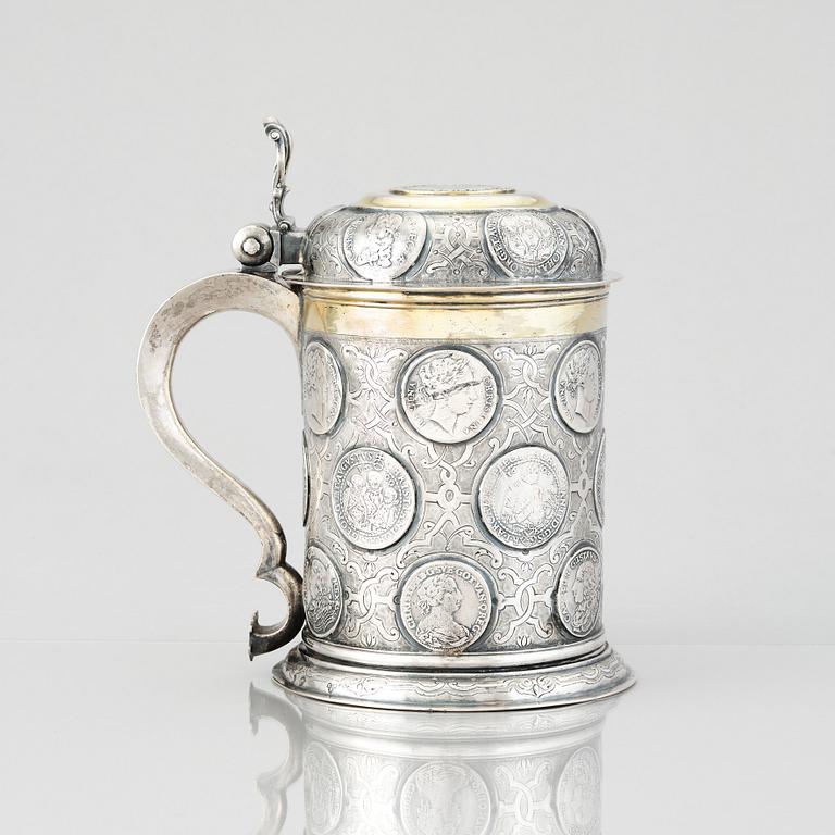 A German 18th century parcel-gilt silver coin-tankard, mark of Johann Friedrich Beyer, Schweidnitz (1736-1775).