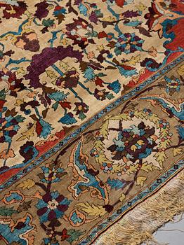 A RUG. An antique silk Kashan so called Motachem. 202,5 x 136,5 cm.