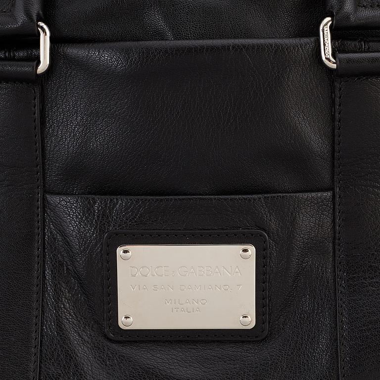 DOLCE & GABBANA, a black leather weekend bag, 2009.
