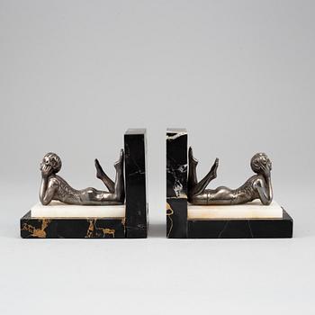 A pair of marble and silver plate art déco book ends.