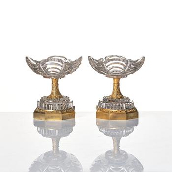 A pair of French Empire early 19th century gilt bronze and glass centre pieces.