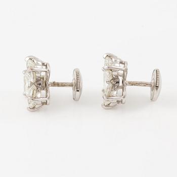 A pair of Cartier earrings in 18K white gold with six heart-shaped brilliant-cut diamonds.