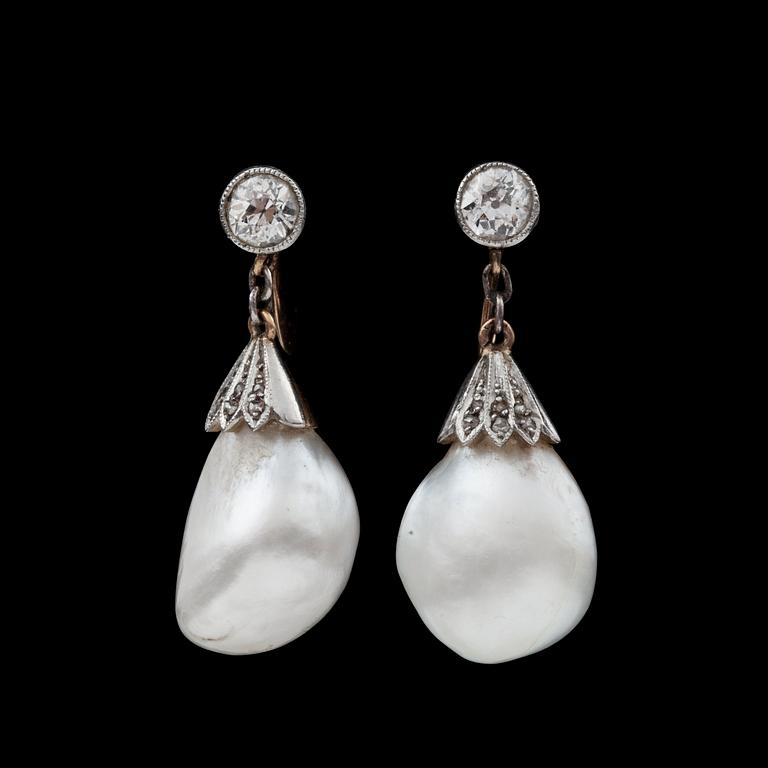 A pair of oriental pearl earrings set with brillaint cut diamonds, app. 0.30 each.