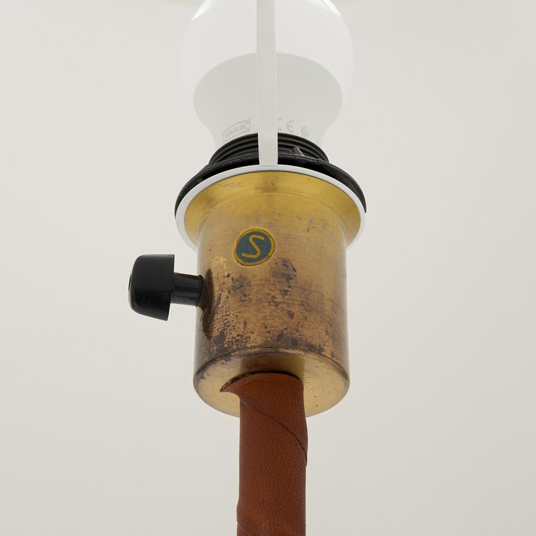 Nordiska Kompaniet, a brass floor lamp, mid 20th century.