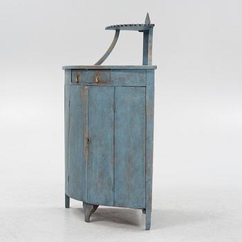 A painted corner cabinet, late 19th century.